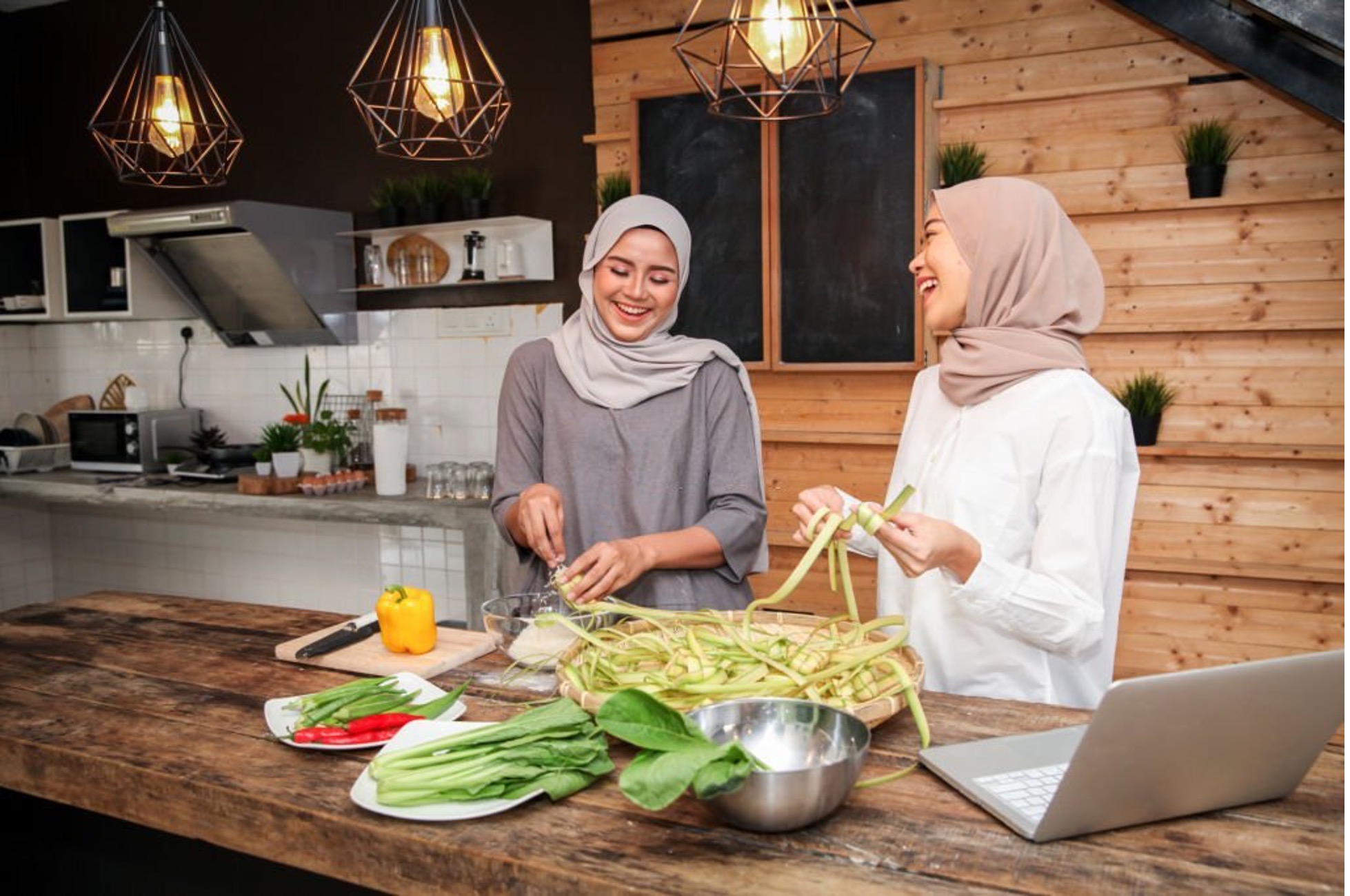 2 muslim girls preparing food